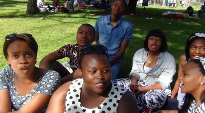 Group discussion with young adults in a park