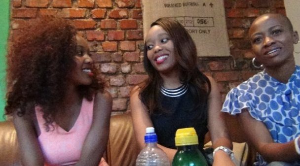 Three women taking part in a group discussion
